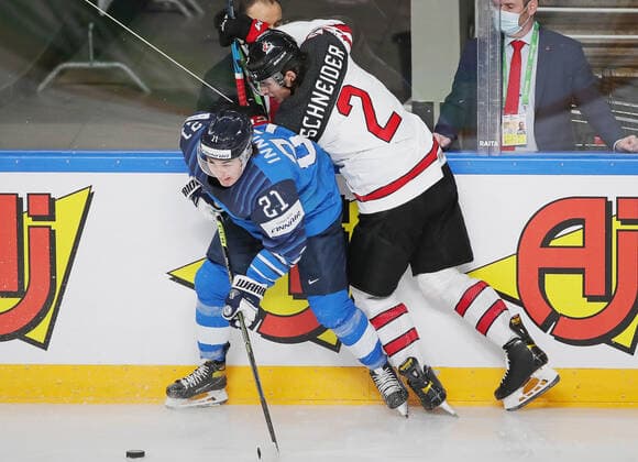 RIGA, LATVIA - JUNE 6, 2021: Finland s Jere Innala (L) and Canada s Braden Schneider in their 2021 IIHF World Championship, WM, Weltmeisterschaft Final Ice hockey, Eishockey match at Arena Riga. Natalia Fedosenko TASS  TS103E73