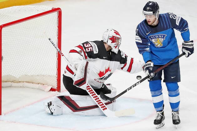 RIGA, LATVIA - JUNE 6, 2021: Canadian goaltender Darcy Kuemper (L) defends against Finland s Niko Ojamaki in their 2021 IIHF World Championship, WM, Weltmeisterschaft Final Ice hockey, Eishockey match at Arena Riga. Natalia Fedosenko TASS  TS103E7C