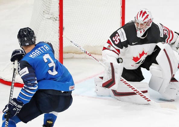 RIGA, LATVIA - JUNE 6, 2021: Canadian goaltender Darcy Kuemper (R) defends against Finland s Olli Maatta in their 2021 IIHF World Championship, WM, Weltmeisterschaft Final Ice hockey, Eishockey match at Arena Riga. Natalia Fedosenko TASS  TS103E7E