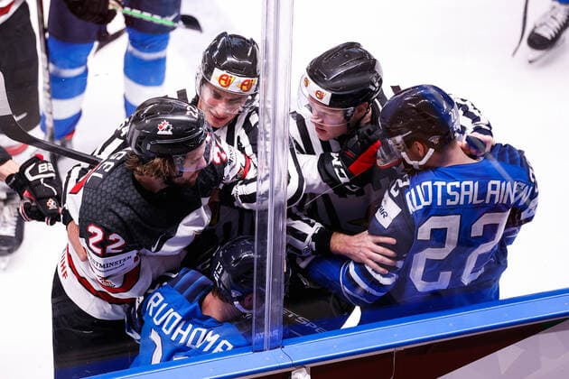06 06 2021, Riga, Arena Riga, Final Finland Canada 2021 IIHF Ice Hockey World Championship , 22 Brandon Hagel Canada against 22 Arttu Ruotsalainen Finland and 13 Mikael Ruohomaa Finland separated by referees Riga Riga Latvia  Copyright: xJustPictures.ch JarixPestelaccix