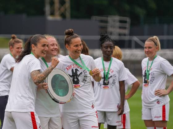 Cologne, Germany, June 6th 2021: Francesca Calo (2 1. FC Koeln), Amber Barrett (22 1. FC Koeln) and Sabrina Horvat (3 1. FC Koeln) after winning the 2. Womens Bundesliga South title at the Franz-Kremer-Stadium in Cologne, Germany. 2. Womens Bundesliga South - 1. FC K?ln v SG 99 Andernach 
