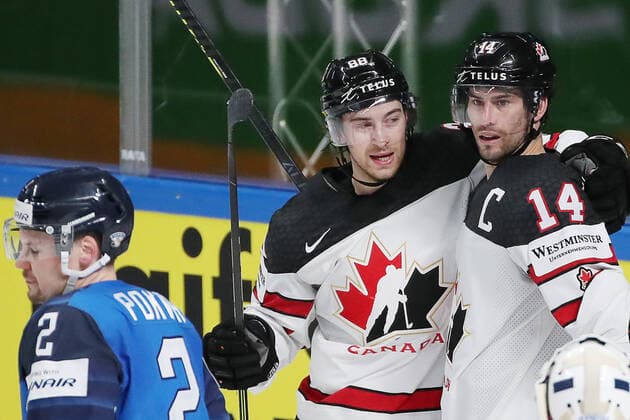 RIGA, LATVIA - JUNE 6, 2021: Canada s Adam Henrique and Andrew Mangiapane (R-L) celebrate a goal scored against Finland in their 2021 IIHF World Championship, WM, Weltmeisterschaft Final Ice hockey, Eishockey match at Arena Riga; Canada won 3-2 in overtime. Natalia Fedosenko TASS  TS103E9E