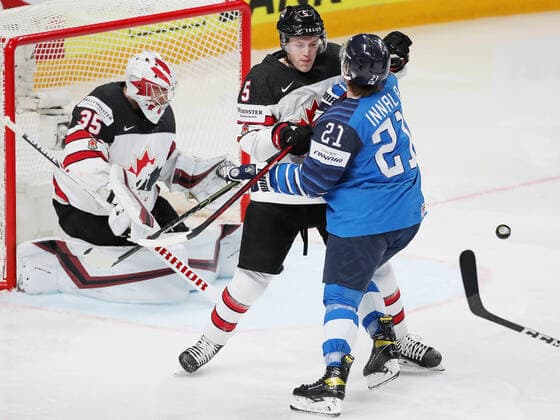 RIGA, LATVIA - JUNE 6, 2021: Canadian goaltender Darcy Kuemper supported by Jacob Bernard-Docker defends against Finland s Jere Innala in their 2021 IIHF World Championship, WM, Weltmeisterschaft Final Ice hockey, Eishockey match at Arena Riga; Canada won 2-3 in overtime. Natalia Fedosenko TASS  TS103EA0