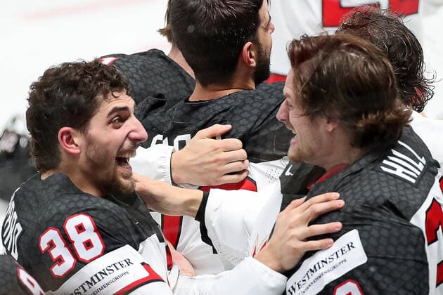 RIGA, LATVIA - JUNE 6, 2021: Canada s Mario Ferraro, Adin Hill (L-R front) and their teammates celebrate victory over Finland in their 2021 IIHF World Championship, WM, Weltmeisterschaft Final Ice hockey, Eishockey match at Arena Riga; Canada won 3-2 in overtime. Natalia Fedosenko TASS  TS103EAC