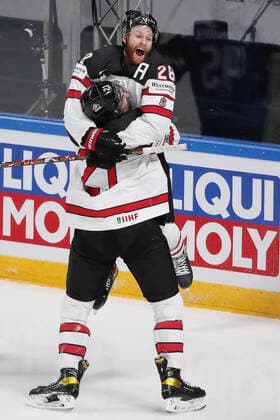 RIGA, LATVIA - JUNE 6, 2021: Canada s Connor Brown (top) and Nick Paul celebrate victory over Finland in their 2021 IIHF World Championship, WM, Weltmeisterschaft Final Ice hockey, Eishockey match at Arena Riga; Canada won 3-2 in overtime. Natalia Fedosenko TASS  TS103EB6