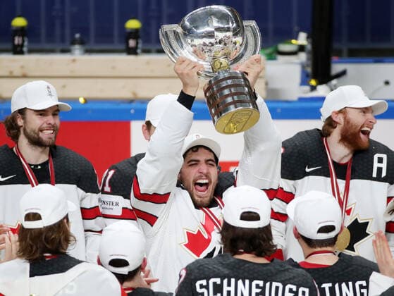 RIGA, LATVIA - JUNE 6, 2021: Canada s Mario Ferraro (C) lifts their trophy as they celebrate victory over Finland in their 2021 IIHF World Championship, WM, Weltmeisterschaft Final Ice hockey, Eishockey match at Arena Riga; Canada won 3-2 in overtime. Natalia Fedosenko TASS  TS103EBC