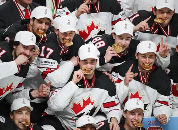 RIGA, LATVIA - JUNE 6, 2021: Canadian pose with their medals as they celebrate victory over Finland in their 2021 IIHF World Championship, WM, Weltmeisterschaft Final Ice hockey, Eishockey match at Arena Riga; Canada won 3-2 in overtime. Natalia Fedosenko TASS  TS103EC1