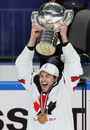 RIGA, LATVIA - JUNE 6, 2021: A Canadian player lifts their trophy as they celebrate victory over Finland in their 2021 IIHF World Championship, WM, Weltmeisterschaft Final Ice hockey, Eishockey match at Arena Riga; Canada won 3-2 in overtime. Natalia Fedosenko TASS  TS103EC2