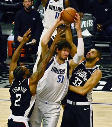 Dallas Mavericks center Boban Marjanovic (51) is double teamed by Los Angeles Clippers defenders during the second half of Game 7 of their first-round playoff matchup at Staples Center in Los Angeles on June 6, 2021. The Clippers defeated the Mavericks 126-111. They advance to face the top-seeded Jazz starting Tuesday in Utah.  LAP2021060604 JIMxRUYMEN