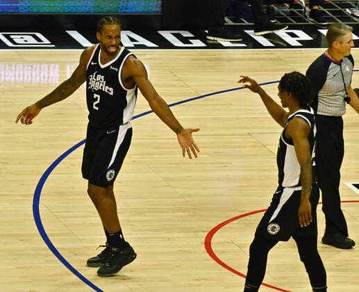 Los Angeles Clippers forward Kawhi Leonard (2) and guard Terance Mann (14) celebrate their Game 7 win against the Dallas Mavericks at Staples Center in Los Angeles on June 6, 2021. The Clippers defeated the Mavericks 126-111. They advance to face the top-seeded Jazz starting Tuesday in Utah.  LAP2021060614 JIMxRUYMEN