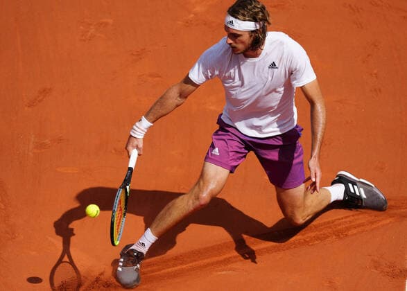 (210607) -- PARIS, June 7, 2021 -- Stefanos Tsitsipas of Greece returns the ball during the men s singles fourth round match between Stefanos Tsitsipas of Greece and Pablo Carreno Busta of Spain at the French Open tennis tournament at Roland Garros in Paris, France, June 6, 2021. ) (SP)FRANCE-PARIS-TENNIS-ROLAND GARROS-FRENCH OPEN-MEN S SINGLES GaoxJing 