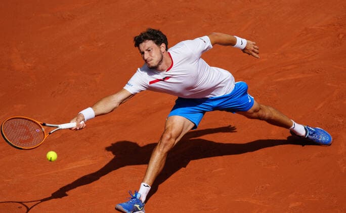(210607) -- PARIS, June 7, 2021 -- Pablo Carreno Busta of Spain returns the ball during the men s singles fourth round match between Stefanos Tsitsipas of Greece and Pablo Carreno Busta of Spain at the French Open tennis tournament at Roland Garros in Paris, France, June 6, 2021. ) (SP)FRANCE-PARIS-TENNIS-ROLAND GARROS-FRENCH OPEN-MEN S SINGLES GaoxJing 