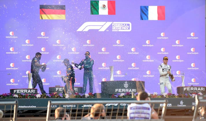 (210607) -- BAKU, June 7, 2021 -- Sergio Perez (2nd L) of Reb Bull, Sebastian Vettel (2nd R) of Aston Martin and Pierre Gasly (1st R) of AlphaTauri celebrate during the awarding ceremony for the Formula 1 2021 Azerbaijan Grand Prix at Baku City Circuit in Baku, Azerbaijan, June 6, 2021. (Photo by Tofiq Babayev Xinhua) (SP)AZERBAIJAN-BAKU-2021 F1 AZERBAIJAN GRAND PRIX LixMing 