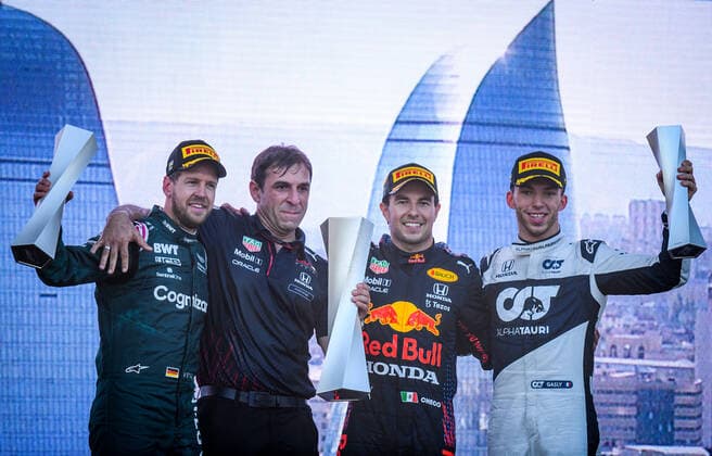 (210607) -- BAKU, June 7, 2021 -- Sergio Perez (2nd R) of Reb Bull, Sebastian Vettel (1st L) of Aston Martin and Pierre Gasly (1st R) of AlphaTauri pose for photos during the awarding ceremony for the Formula 1 2021 Azerbaijan Grand Prix at Baku City Circuit in Baku, Azerbaijan, June 6, 2021. (Photo by Tofiq Babayev Xinhua) (SP)AZERBAIJAN-BAKU-2021 F1 AZERBAIJAN GRAND PRIX LixMing 