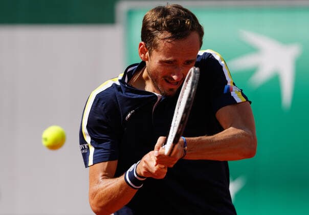 (210607) -- PARIS, June 7, 2021 -- Daniil Medvedev of Russia returns the ball during the men s singles fourth round match between Daniil Medvedev of Russia and Cristian Garin of Chile at the French Open tennis tournament at Roland Garros in Paris, France, June 6, 2021. ) (SP)FRANCE-PARIS-TENNIS-ROLAND GARROS-FRENCH OPEN-MEN S SINGLES GaoxJing 
