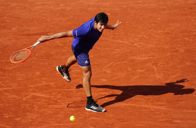 (210607) -- PARIS, June 7, 2021 -- Cristian Garin of Chile returns the ball during the men s singles fourth round match between Daniil Medvedev of Russia and Cristian Garin of Chile at the French Open tennis tournament at Roland Garros in Paris, France, June 6, 2021. ) (SP)FRANCE-PARIS-TENNIS-ROLAND GARROS-FRENCH OPEN-MEN S SINGLES GaoxJing 