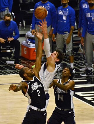 Dallas Mavericks center Boban Marjanovic (51) and Los Angeles Clippers forward Kawhi Leonard (2) battle for control of the rebound during the first half of Game 7 of their first-round playoff series matchup at Staples Center in Los Angeles on June 6, 2021. The Clippers defeated the Mavericks 126-111. They advance to face the top-seeded Jazz starting Tuesday in Utah.  LAP2021060625 JIMxRUYMEN