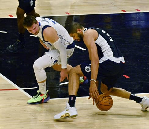 Los Angeles Clippers forward Nicolas Batum (33) steals the ball from Dallas Mavericks guard Luka Doncic (77) during the first half of Game 7 of their first-round playoff series matchup at Staples Center in Los Angeles on June 6, 2021. The Clippers defeated the Mavericks 126-111. They advance to face the top-seeded Jazz starting Tuesday in Utah.  LAP2021060629 JIMxRUYMEN