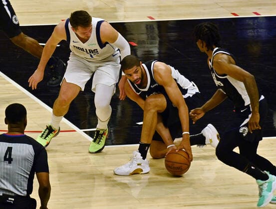 Los Angeles Clippers forward Nicolas Batum (33) steals the ball from Dallas Mavericks guard Luka Doncic (77) during the first half of Game 7 of their first-round playoff series matchup at Staples Center in Los Angeles on June 6, 2021. The Clippers defeated the Mavericks 126-111. They advance to face the top-seeded Jazz starting Tuesday in Utah.  LAP2021060630 JIMxRUYMEN
