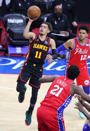 June 6, 2021, Philadelphia, PA, USA: Atlanta Hawks guard Trae Young goes to the basket for two points past Philadelphia 76ers center Joel Embiid and forward Tobias Harris during the second half in a NBA, Basketball Herren, USA second round Eastern Conference playoff basketball game on Sunday, Jun 6, 2021, in Philadelphia. Philadelphia USA - ZUMAm67_ 0120587464st Copyright: xCurtisxComptonx