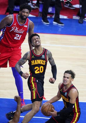 June 6, 2021, Philadelphia, PA, USA: Atlanta Hawks forward John Collins (center) reacts after slamming for two points and drawing the foul from Philadelphia 76ers center Joel Embiid (left) on a lob pass to the basket from Trae Young (right) during the final seconds of a 128-124 Hawks victory in a NBA, Basketball Herren, USA second round Eastern Conference playoff basketball game on Sunday, Jun 6, 2021, in Philadelphia. Philadelphia USA - ZUMAm67_ 0120587787st Copyright: xCurtisxComptonx