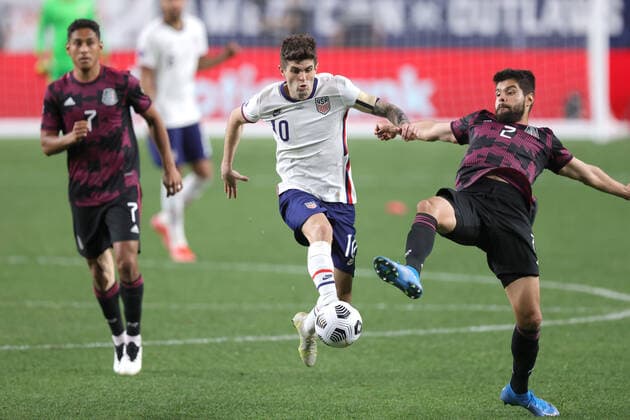 DENVER, CO - JUNE 06: United States forward Christian Pulisic (10) battles with Mexico defender Nestor Araujo (2) in action during the CONCACAF Nations League finals between Mexico and the United States on June 06, 2021, at Empower Field at Mile High in Denver, CO. (Photo by Robin Alam Icon Sportswire) SOCCER: JUN 06 Concacaf Nations League Final - Mexico v United States Icon164210606022
