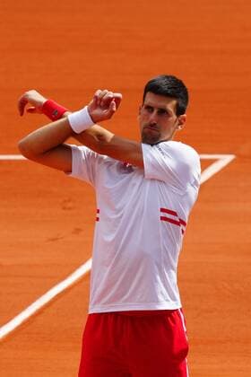 Mandatory Credit: Photo by Javier Garcia BPI Shutterstock (12019129gd) Novak Djokovic stretches as his opponent goes for an injury time out French Open Tennis, Day Nine, Roland Garros, Paris, France - 07 Jun 2021 French Open Tennis, Day Nine, Roland Garros, Paris, France - 07 Jun 2021  Copyright: xJavierxGarcia BPI Shutterstockx 12019129gd