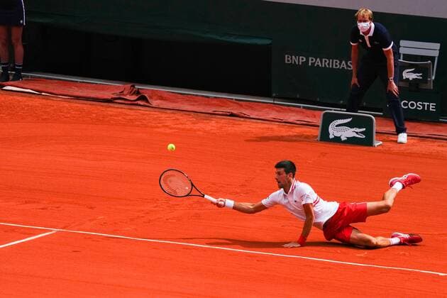 Mandatory Credit: Photo by Javier Garcia BPI Shutterstock (12019129hl) Novak Djokovic plays a forehand shot from the ground French Open Tennis, Day Nine, Roland Garros, Paris, France - 07 Jun 2021 French Open Tennis, Day Nine, Roland Garros, Paris, France - 07 Jun 2021  Copyright: xJavierxGarcia BPI Shutterstockx 12019129hl