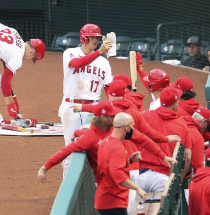 Baseball: Royals vs. Angels Shohei Ohtani (17) is congratulated by Los Angeles Angels teammates after scoring a run in the first inning of a game against the Kansas City Royals on June 7, 2021, at Angel Stadium in Anaheim, California. 