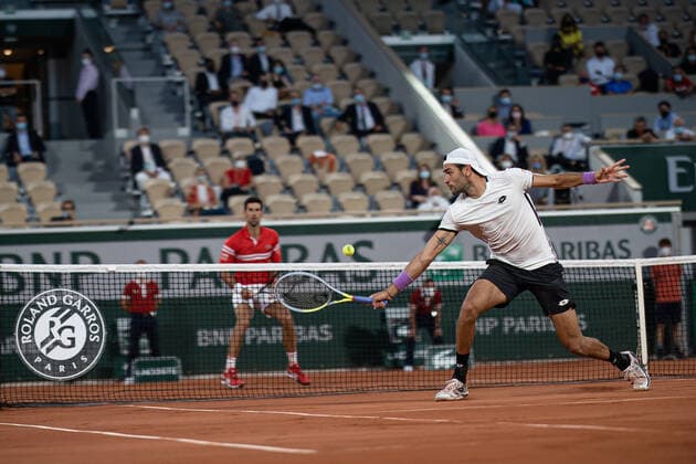 (210610) -- PARIS, June 10, 2021 -- Matteo Berrettini (R) of Italy and Novak Djokovic of Serbia compete during their men s singles quarterfinal at the French Open tennis tournament at Roland Garros in Paris, France, June 9, 2021. (Photo by Xinhua) (SP)FRANCE-PARIS-TENNIS-ROLAND GARROS-FRENCH OPEN-MEN S SINGLES-DAY 11 AurelienxMorissard 