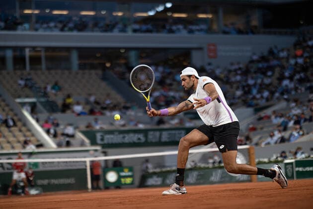 (210610) -- PARIS, June 10, 2021 -- Matteo Berrettini of Italy hits a return during the men s singles quarterfinal against Novak Djokovic of Serbia at the French Open tennis tournament at Roland Garros in Paris, France, June 9, 2021. (Photo by Xinhua) (SP)FRANCE-PARIS-TENNIS-ROLAND GARROS-FRENCH OPEN-MEN S SINGLES-DAY 11 AurelienxMorissard 