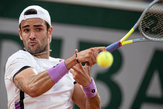 (210610) -- PARIS, June 10, 2021 -- Matteo Berrettini of Italy hits a return during the men s singles quarterfinal against Novak Djokovic of Serbia at the French Open tennis tournament at Roland Garros in Paris, France, June 9, 2021. (Photo by Xinhua) (SP)FRANCE-PARIS-TENNIS-ROLAND GARROS-FRENCH OPEN-MEN S SINGLES-DAY 11 AurelienxMorissard 