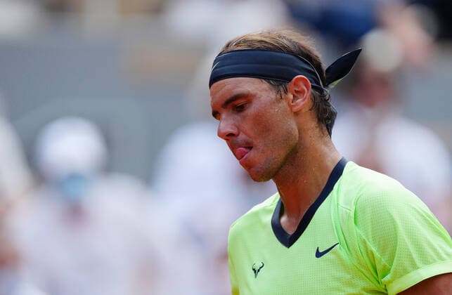 (210610) -- PARIS, June 10, 2021 -- Rafael Nadal of Spain reacts during the men s singles quarterfinal against Diego Schwartzman of Argentina at the French Open tennis tournament at Roland Garros in Paris, France, June 9, 2021. ) (SP)FRANCE-PARIS-TENNIS-ROLAND GARROS-FRENCH OPEN-MEN S SINGLES-DAY 11 GaoxJing 