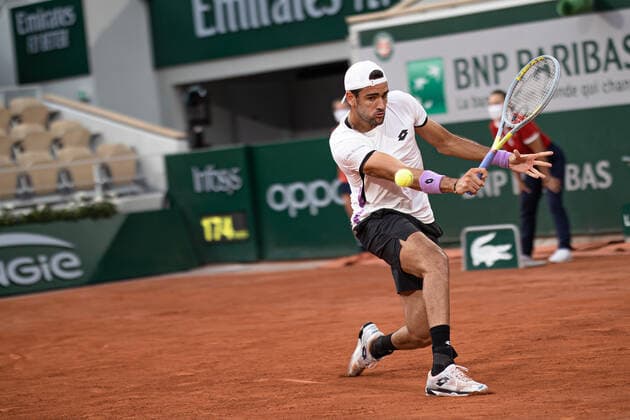 (210610) -- PARIS, June 10, 2021 -- Matteo Berrettini of Italy hits a return during the men s singles quarterfinal against Novak Djokovic of Serbia at the French Open tennis tournament at Roland Garros in Paris, France, June 9, 2021. (Photo by Xinhua) (SP)FRANCE-PARIS-TENNIS-ROLAND GARROS-FRENCH OPEN-MEN S SINGLES-DAY 11 AurelienxMorissard 