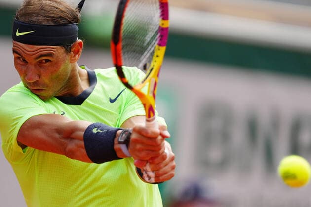 (210610) -- PARIS, June 10, 2021 -- Rafael Nadal of Spain hits a return during the men s singles quarterfinal against Diego Schwartzman of Argentina at the French Open tennis tournament at Roland Garros in Paris, France, June 9, 2021. ) (SP)FRANCE-PARIS-TENNIS-ROLAND GARROS-FRENCH OPEN-MEN S SINGLES-DAY 11 GaoxJing 
