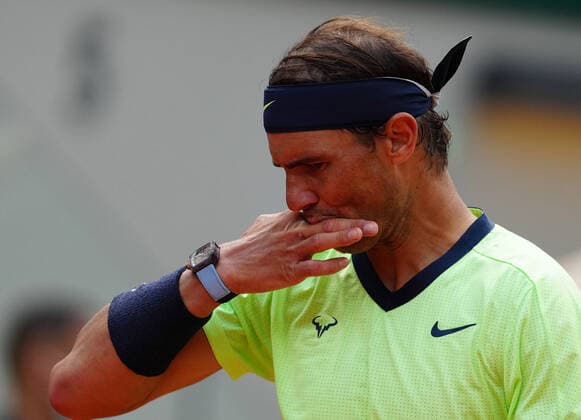 (210610) -- PARIS, June 10, 2021 -- Rafael Nadal of Spain reacts during the men s singles quarterfinal against Diego Schwartzman of Argentina at the French Open tennis tournament at Roland Garros in Paris, France, June 9, 2021. ) (SP)FRANCE-PARIS-TENNIS-ROLAND GARROS-FRENCH OPEN-MEN S SINGLES-DAY 11 GaoxJing 