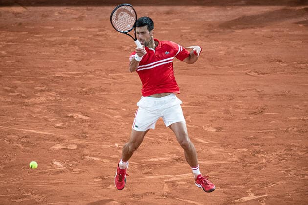 (210610) -- PARIS, June 10, 2021 -- Novak Djokovic of Serbia hits a return during the men s singles quarterfinal against Matteo Berrettini of Italy at the French Open tennis tournament at Roland Garros in Paris, France, June 9, 2021. (Photo by Xinhua) (SP)FRANCE-PARIS-TENNIS-ROLAND GARROS-FRENCH OPEN-MEN S SINGLES-DAY 11 AurelienxMorissard 