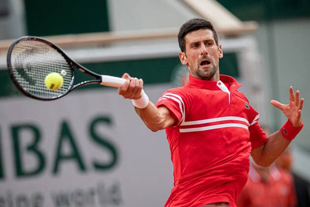 (210610) -- PARIS, June 10, 2021 -- Novak Djokovic of Serbia hits a return during the men s singles quarterfinal against Matteo Berrettini of Italy at the French Open tennis tournament at Roland Garros in Paris, France, June 9, 2021. (Photo by Xinhua) (SP)FRANCE-PARIS-TENNIS-ROLAND GARROS-FRENCH OPEN-MEN S SINGLES-DAY 11 AurelienxMorissard 
