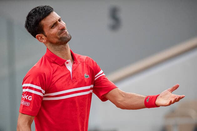 (210610) -- PARIS, June 10, 2021 -- Novak Djokovic of Serbia reacts during the men s singles quarterfinal against Matteo Berrettini of Italy at the French Open tennis tournament at Roland Garros in Paris, France, June 9, 2021. (Photo by Xinhua) (SP)FRANCE-PARIS-TENNIS-ROLAND GARROS-FRENCH OPEN-MEN S SINGLES-DAY 11 AurelienxMorissard 