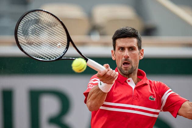 (210610) -- PARIS, June 10, 2021 -- Novak Djokovic of Serbia hits a return during the men s singles quarterfinal against Matteo Berrettini of Italy at the French Open tennis tournament at Roland Garros in Paris, France, June 9, 2021. (Photo by Xinhua) (SP)FRANCE-PARIS-TENNIS-ROLAND GARROS-FRENCH OPEN-MEN S SINGLES-DAY 11 AurelienxMorissard 