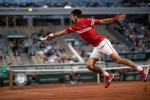(210610) -- PARIS, June 10, 2021 -- Novak Djokovic of Serbia hits a return during the men s singles quarterfinal against Matteo Berrettini of Italy at the French Open tennis tournament at Roland Garros in Paris, France, June 9, 2021. (Photo by Xinhua) (SP)FRANCE-PARIS-TENNIS-ROLAND GARROS-FRENCH OPEN-MEN S SINGLES-DAY 11 AurelienxMorissard 