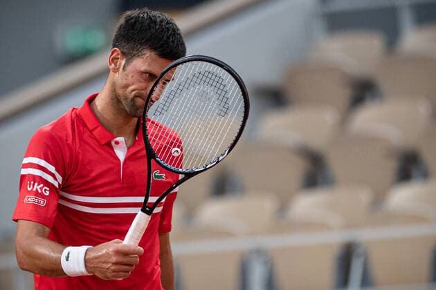 (210610) -- PARIS, June 10, 2021 -- Novak Djokovic of Serbia reacts during the men s singles quarterfinal against Matteo Berrettini of Italy at the French Open tennis tournament at Roland Garros in Paris, France, June 9, 2021. (Photo by Xinhua) (SP)FRANCE-PARIS-TENNIS-ROLAND GARROS-FRENCH OPEN-MEN S SINGLES-DAY 11 AurelienxMorissard 