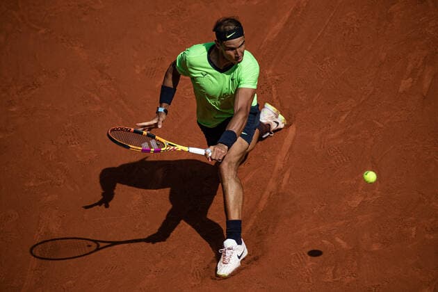 (210610) -- PARIS, June 10, 2021 -- Rafael Nadal of Spain hits a return during the men s singles quarterfinal against Diego Schwartzman of Argentina at the French Open tennis tournament at Roland Garros in Paris, France, June 9, 2021. (Photo by Aurelien Morissard Xinhua) (SP)FRANCE-PARIS-TENNIS-ROLAND GARROS-FRENCH OPEN-MEN S SINGLES-DAY 11 AoxLeilian¡¤molisaer 