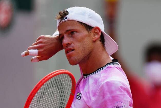 (210610) -- PARIS, June 10, 2021 -- Diego Schwartzman of Argentina reacts during the men s singles quarterfinal against Rafael Nadal of Spain at the French Open tennis tournament at Roland Garros in Paris, France, June 9, 2021. ) (SP)FRANCE-PARIS-TENNIS-ROLAND GARROS-FRENCH OPEN-MEN S SINGLES-DAY 11 GaoxJing 