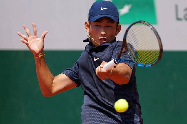 (210610) -- PARIS, June 10, 2021 -- Shang Juncheng of China hits a return during the boys singles third round match against Leo Borg of Sweden at the French Open tennis tournament at Roland Garros in Paris, France, June 9, 2021. ) (SP)FRANCE-PARIS-TENNIS-ROLAND GARROS-FRENCH OPEN-BOY S SINGLES-DAY 11 GaoxJing 