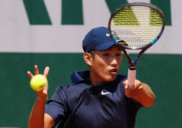 (210610) -- PARIS, June 10, 2021 -- Shang Juncheng of China hits a return during the boys singles third round match against Leo Borg of Sweden at the French Open tennis tournament at Roland Garros in Paris, France, June 9, 2021. ) (SP)FRANCE-PARIS-TENNIS-ROLAND GARROS-FRENCH OPEN-BOY S SINGLES-DAY 11 GaoxJing 