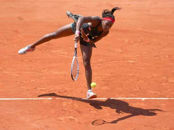 (210610) -- PARIS, June 10, 2021 -- Coco Gauff of the United States serves during the women s singles quarterfinal against Barbora Krejcikova of the Czech Republic at the French Open tennis tournament at Roland Garros in Paris, France, June 9, 2021. ) (SP)FRANCE-PARIS-TENNIS-ROLAND GARROS-FRENCH OPEN-WOMEN S SINGLES-DAY 11 GaoxJing 