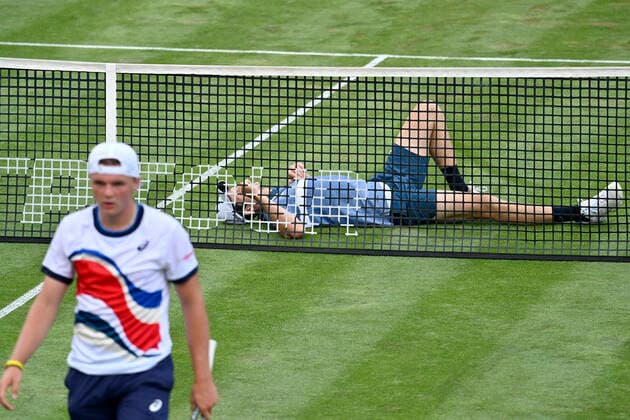 Dominic Stephan Stricker SUI Action defeats Hubert Hurkacz POL at the net, who lies frustrated on the ground 10 06 2021 Tennis MercedesCup Stuttgart 2021 Weißenhof ATP 07 13 06 2021 Tennis MercedesCup Stuttgart 2021