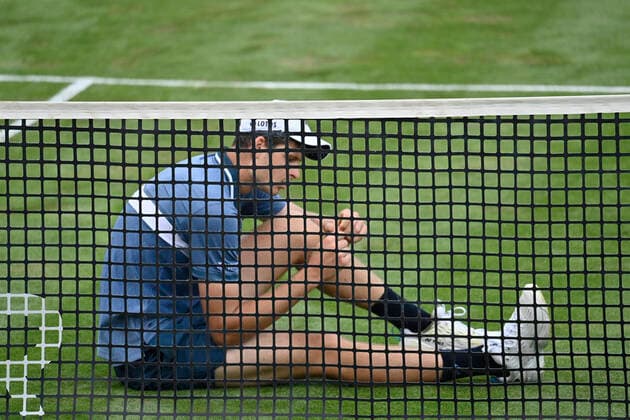 Dominic Stephan Stricker SUI Action defeats Hubert Hurkacz POL at the net, who lies frustrated on the ground 10 06 2021 Tennis MercedesCup Stuttgart 2021 Weißenhof ATP 07 13 06 2021 Tennis MercedesCup Stuttgart 2021
