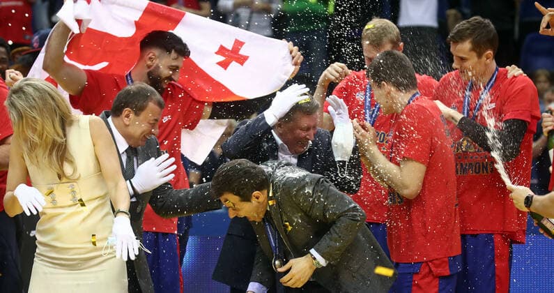 MOSCOW, RUSSIA - JUNE 10, 2021: President and General Director of PBC CSKA Moscow Andrei Vatutin (L midground), CSKA Moscow s head coach DImitrios Itoudis (C front), Russia s Special Presidential Representative for Environmental Protection, Ecology and Transport Sergei Ivanov (C midground) and CSKA Moscow players spray champagne as they celebrate winning the VTB United League title after defeating UNICS Kazan 89-81 in Game 3 of the 2021 2022 VTB United League final series at CSKA Arena. Valery Sharifulin TASS  TS1044BB